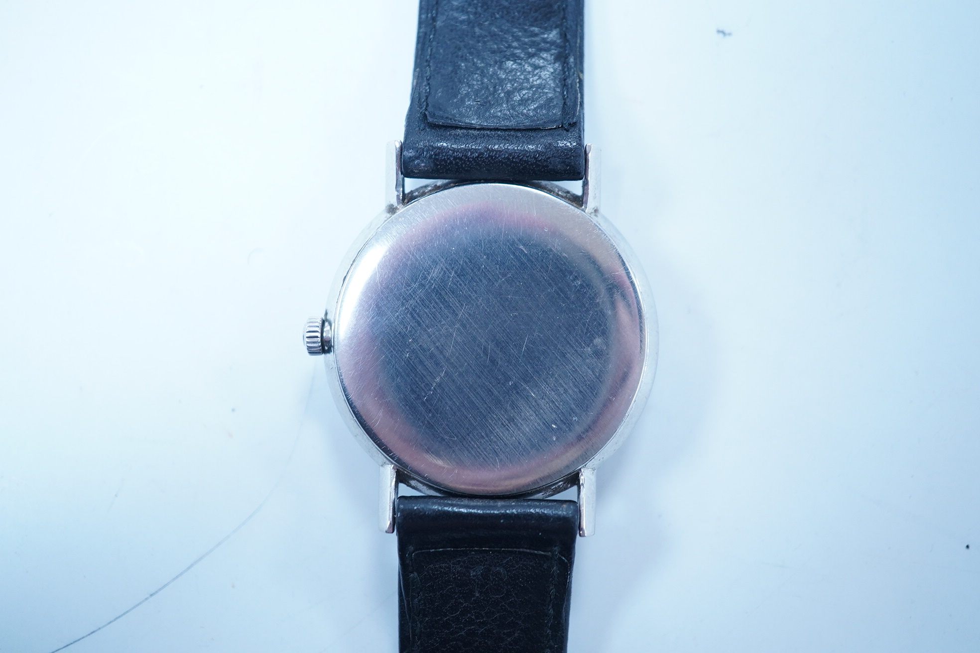 A gentleman's late 1960's stainless steel Omega manual wind wrist watch, with baton numerals and date aperture, movement c.613, case diameter 34mm, on a later associated leather strap. Condition - poor to fair